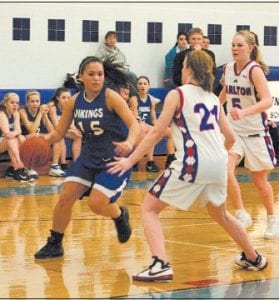 Above: Senior Christina Nelson taking it to the hoop at the Carlton game. Nelson finished with 23 points in the game that put the Vikings' record at 10-1 overall.