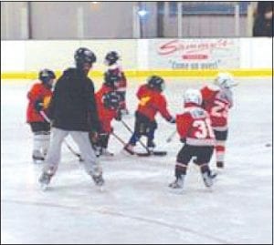 Photo by Roxann Berglund The M-1 hockey team, sponsored by Joynes Ben Franklin, played in the Carlton Jamboree last weekend. Honing their skills are Tanner Berglund #30 and Lucas Sheils #29.