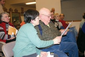 Carol and Nevin Holmberg of Hovland review Republican candidate literature at the GOP caucus at the Cook County Community Center on Feb. 2.