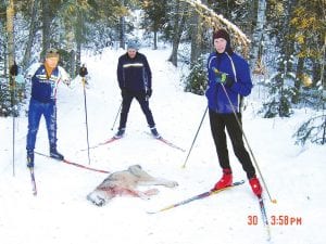 Adam Harju, David Eckel, and Keith Morris explore the Pincushion Mountain trail where Eckel found a dead wolf. Left: It was determined that the wolf had been killed by another wolf. Minnesota Department of Natural Resources Conservation Officer Mary Manning said this is not an unusual occurrence, but it is unusual that the animal was found so close to humans.