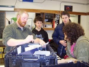 The CCHS robotics team is in full swing creating its soccer-playing robot for an April 1-3 competition in the Twin Cities. From left, industrial arts teacher Eli Hill, Karl Ingebrigtsen, Alec Neilsen, and Max Simonowicz.