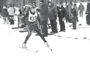 Audrey Summers crossing the finish line of the girls' Classic race at Pincushion Mountains.