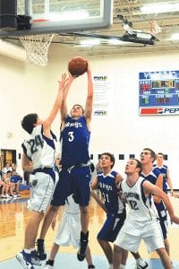 Ryan Martinson, pictured here under the basket versus Carlton, had a terrific game against Babbitt last week, leading the Vikings with 19 points and 12 rebounds.