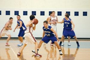 The Vikings defense was solid against the disciplined Ely Timberwolves at the home game on Saturday, February 6. Defenders, left to right: James Groth, Colin Everson, Ryan Martinson.