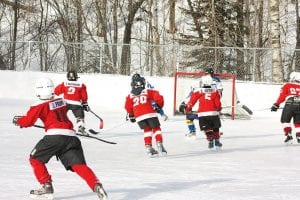 Cook County Mites on Woodland’s outdoor ice! Josh Prom, Tristen Bockovich, Will Ramberg, Connor Somnis and Jayden Grivette.