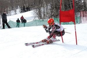 Anders Zimmer, 14, shoots past a gate on the slalom during a recent United States Skiing Association race.