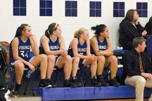 On Tuesday, February 16, the Viking girls had a great game against the Wrenshall Wrens, with a decisive 79-12 win. Above: The Viking starters sat out the second half to give the bench plenty of playing time. Watching the younger players during a recent home game are (L-R) Brea Boomer, Essa Jacobsen, Ailee Larson, Christina Nelson. Coach T.J. Super in front. Right: Against the Wrenshall Wrens, sophomore Molly Zafft (pictured at the Marshall game) scored 12 points off the bench.