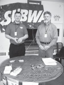 Trying to capture citizens’ interest as sports fans entered the Cook County High School gym for a basketball game Friday, February 5 were U.S. census workers Adam Jaros of Duluth left) and Jim Anderson of Grand Marais. They offered information, pens and magnetic clips and encouraged residents to fill out their census surveys.