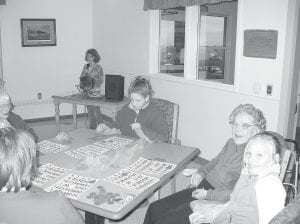 Above: Students from the Cook County Kids Plus Program visit the Care Center twice a month to play bingo, card games, and help with community service projects. Left: Kids Plus students enjoy Exercise Group when they get to use the hover sphere helium ball with residents.