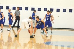 The Cook County boys’ basketball team faced the very tough Barnum Bombers on Friday, February 26. Left: Senior James Groth went airborne for several shots and made a number of back-to-back baskets. Above: Viking defensemen Kale Boomer and David Bergstrom played well against Barnum.