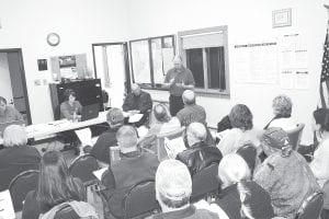 Arrowhead Electric Cooperative, Inc. Manager Don Stead (standing) talks to Lutsen citizens about the cooperative's proposal to proceed with a countywide broadband internet service.