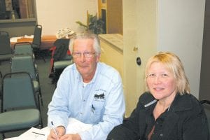 Tofte Town Clerk Barb Gervais welcomes newly elected Supervisor Jim King to the table.