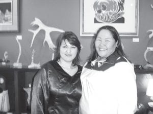 Lydia Etok (L) and Nina Segalowitz, Inuit throat singers from Canada, graciously returned to Grand Marais to perform together on Saturday, March 13, 2010 at Sivertson Gallery. They interspersed their singing with perspectives on personal and cultural efforts to preserve Inuit traditions. The women demonstrated numerous songs, each an imitation of something in traditional Inuit life, such as the sound of the wind, a saw, or a puppy. Throat singing is a competition, usually between women holding onto one another’s forearms and swaying in a circular motion while they sing. The competition always ends in laughter, the loser being the first one to laugh. By the fun Etok and Segalowitz had singing together, it was apparent that no one really loses.