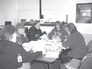 Sawtooth Elementary Principal Gwen Carman meets to review students' reading progress with teachers Deonn Cicak, Betsy Jorgenson, Joan Ege, and Dena Schliep.