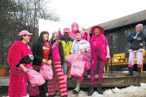 Lower right: Winning the sled pushing, straw shoveling, poop scooping, watering and feeding competition was the team named Magenta Mammary Mushers (M3).