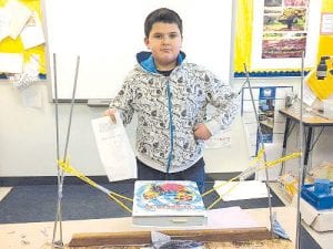 Above: Douglas Pervais demonstrates his invention 