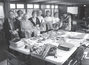 Quilts for Haiti. The Bethlehem Lutheran Church Women (BLCW) have been busy collecting supplies for health kits and school kits for the Lutheran World Relief Organization to send to Haiti. They collected enough to send 48 health kits and 52 school kits. The quilters of the church also made 239 quilts this past year. These go to the Red Cross, Damiano Center, Salvation Army, a complex for the homeless in Minneapolis called “The Center for Changing Lives” and others in need. Pictured assembling the school kits for Haiti at Bethlehem Lutheran Church are, from left, Eleanor Waha, Jody Daugherty, Joan Bieber, Mary McElevey, Ethel Johnson, Milly Gestel, Gwen Lenz and Crystal Nelson.