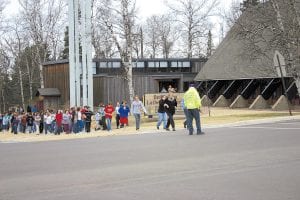 Tuesday, April 13 brought an exciting afternoon for School District 166 students after a science experiment filled the school’s upper halls with smoke and set off alarms. Middle School students who had been evacuated to Bethlehem Lutheran Church across the street from the school file back to school after the Grand Marais Fire Department gave the all-clear announcement.