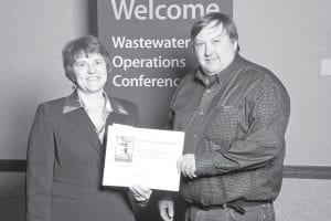 The Minnesota Pollution Control Agency recently recognized two local men for their outstanding performance in wastewater operations in 2009. Presenting the award at the 73rd annual Wastewater Operations Conference was Rebecca Flood. Far Left: Tom Nelson of the Grand Marais Public Utilities Commission accepts his award. Left: Ryan Brandt of the Superior National Golf Properties homeowner’s association receives congratulations from Flood.