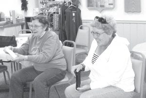 Above: Visitors to the Grand Marais Senior Center have been enjoying the Nintendo Wii game system. Nona Smith (left) races through the Cow Maze game, trying to beat her daughter, Sally Suck. The women are “racing” Holstein or Jersey cows.