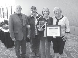 Shelé Toftey at the Duluth DECC after receiving the 2010 UMD Joel Labovitz Entrepreneurial Success Award for Dockside Fish Market. Shelé and her husband, Harley, have operated Dockside in downtown Grand Marais since June 1998. Left: Attending the luncheon at the DECC were Dick Powell, Grand Marais Mayor Sue Hakes, Toftey and Laurie Spry.