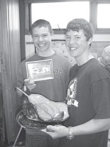 Middle Right: Winning the top judges’ prize for best chili was a group of young men with a meat lover’s chili. Pictured here are Colin Everson (L) and Will Petty. Also on their team were Seth Falk and Jacob Rude. Teams were judged on taste, creativity, and presentation. Groups offered things like cheese, acorn-shaped corn muffins, taco fixings, a video presentation, and great stories to accompany their chili.