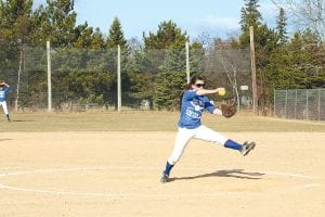 Above: Senior Carly Puch was on the mound for the Vikings in a tough match against the McGregor Mercuries on Tuesday, April 27. Left: Freshman Cecilia Schnobrich at bat.