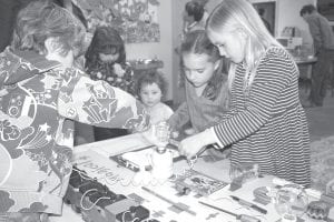 Above: Ian Kurschner explain how electricity works to his fascinated school mates, Charlet Waver and Robin Henrikson.