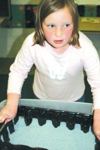 Molly Sietsema has a better idea for those needing to clean out the cat litter. Here she displays her “litter lifter” invention she designed and built for the Science Fair.