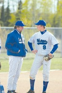 Viking baseball had a rough week with three losses on the road. Above: Baseball Coach Arleigh Jorgenson and sophomore pitcher Dylan Quaife talk strategy. Left: Determined ninth grader Colin Everson at bat.