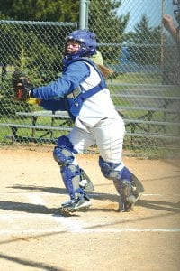 Eighth-grade catcher Anna Carman hustles to get the ball to the outfield.