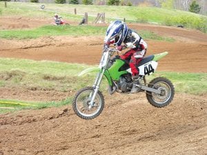 Left: Jacob Smith, 6, gets some airtime in his first motocross race.