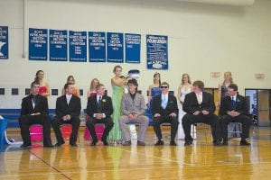 Above: Viking royalty—King Jordan Zunker and Queen Carly Puch. Upper left: Homecoming Queen Ashley Green places the crown on this year’s Prom King Jordan Zunker as his court looks on (L-R) Drew Holmen, Jordan Zunker, and Brock Hommerding. Lower left: Homecoming King Kipp Sande crowns this year’s Prom Queen Carly Puch. The queen candidates smiled and held hands as they awaited coronation. (L-R) Erica Borson, Carly Puch, Samantha Jacobsen.