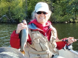 Vince Ekroot and Chris Angelo of Grand Marais were some of the few fishermen who saw success on the 2010 fishing opener weekend. Above: Chris shows off a nice splake caught on Sunday. Right: Vince pictured with their nice Saturday catch of brook trout.