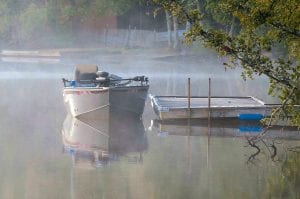 The peaceful atmosphere of summertime has descended on Cook County. This idyllic misty morning scene is on Hungry Jack Lake.