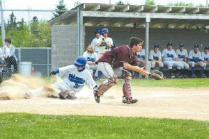 The Vikings defeated the Barnum Bombers in a dramatic seventh inning comeback on Friday, May 21. Above: Colin Everson slides into home. Everson, James Groth and Jacob Rude kept the Viking momentum going with two stolen bases each. Right: Senior Drew Holmen made the final run to capture the Viking win, 5-4.