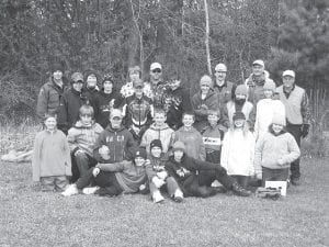 After completing the field portion of their three-week firearm safety and hunter education course, students posed for a photo. (L-R, seated) Rory Bakke, Leo Johnson, Owen Anderson. (L-R, kneeling) Dylan Works, Colton Thompson, Jaret Baker, Andrew Fenstad-Lashinski, Austen Graham, Kyler Johnson, Selien Morawitz, MaeAnna LaFavor. (L-R, standing) Sean Manahan, Joe Rauzi, Jack Wieben, Brandon Curtis, Lucas Phillips, Trace McQuatters, Shauna Blake. (L-R, back row) Tom Wahlstrom, Mary Manning, Jacob Carlson, Eric Nelms, Paul Eiler, Doug Klein, Dave Ingebrigtsen.