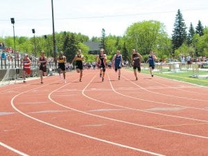 Freshman Peter Warren (third from right) placed sixth in the 100-meter run, running 12.02. He had a personal best in this race as well as the 200-meter, which he finished with a time of 24.79. Warren also led the boys in the long jump.