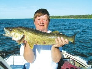 Publisher Deidre Kettunen had a great weekend of fishing on Lake Winnibigoshish in Deer River, MN, catching this 26-inch walleye on Saturday, May 29. She was using a floater jig and leech.