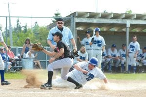 The Vikings played three games this week and advanced to the second round of the Section 7A tournament. Above: Darryl Hansen gives it his all, sliding into home in one of the doubleheaders played against Thunder Bay on Tuesday, May 25. Right: Relief pitcher Clay Gruber-Schultz had a great week, finishing by striking out two of four Cromwell hitters in the fifth to preserve the Viking playoff victory of 13-1 on Saturday, May 29.