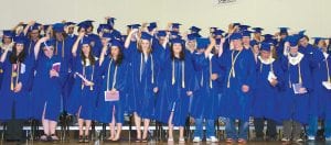 Hats in hand, 2010 Cook County High School seniors get ready to take their first official action as graduates— flinging their caps ceremoniously into the air. Everything gets tougher from here on out, but few things are as memorable as this moment.