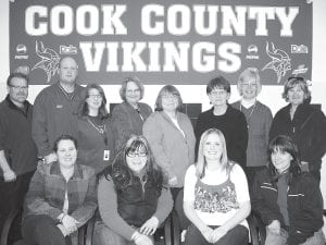 As Cook County High School celebrated its 100th commencement exercises, Principal Gwen Carman noted that there are a number of Cook County High School graduates now working as staff members at the school. (L-R, front) Dena Schliep (1976), Amy Lehto (2003), Stephanie Radloff (2005), Dee Brazell (1983). (L-R, back) Dan Viren (1984), Mitch Dorr (1993), Andra Lilienthal (1984), Dorie Carlson (1969), Sally Deschampe (1977), Kathleen Johnson (1965), Mary MacDonald (1967), Collette Pederson (1971). Not pictured: Cindy Carpenter-Straub (1979), Bill Lovaas (1984), Sue Hennessy (1984), Seth Falk (2006), Bill Tormondsen (1961), John Jacobsen (1970).