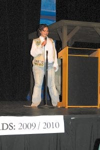 Left: Fawn Smith awards Malin Anderson a pin as she bridges up to the next level of Girl Scouting. Above: Michaela Peterson gave a lovely and inspiring speech at the Court of Awards.