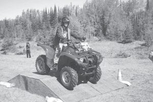 Left: Cassidy Gecas demonstrates that he understands how to drive up and down an incline.