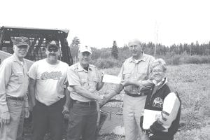 The Arrowhead Chapter of the Minnesota Deer Hunters Association recently presented a check for $5,000 for habitat improvement to the Minnesota DNR. (L-R) Wayne Russ, US Forest Service; Vince Nelson, DNR; Dave Ingebrigtsen, DNR; Pete Harris and Gail Englund of the Arrowhead Deer Hunters Association.