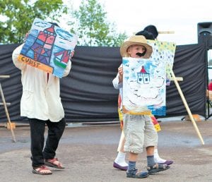 Above left: Artists painting on The Point are prolific as well so they had to be counted too. After being counted, the Solstice Pageant artists showed off their masterpieces. Above right: Uncle Sam, a boating, brief-case carrying census taker, worked to get an accurate count of Northland people and critters.