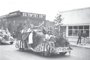 This 4th of July float from 1938 shows that the “Spirit of the North” hasn’t changed all that much over the years. Does anyone know who the women on the float are— and what organization or group they are promoting?