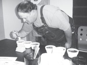 Local coffee roaster Mike Carlson develops his ability to discriminate among various types of coffee bean flavors at a “coffee cupping” class at Moondance Coffee House in Lutsen June 12, 2010. One of the owners of Roastery 7, the Twin Cities wholesaler that provides all of Moondance’s coffee beans, conducted the class. Another will be held in the fall.