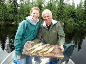 Tracy Funk (left) and Hilary Frerich of Rochester caught enough fish for a great walleye dinner while fishing at an undisclosed lake with Joe Carlson of Joe’s Inland Fishing last week.