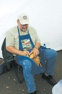 Right: Jim Vannet of Grand Marais returned to the Arts Festival with his fabulous carved fish.